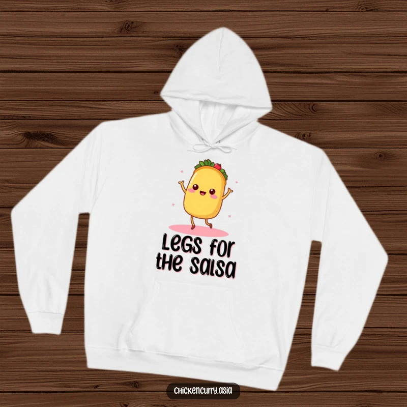 Funny dancing taco hoodie, a character with tiny legs radiating warmth, cozy and festive.